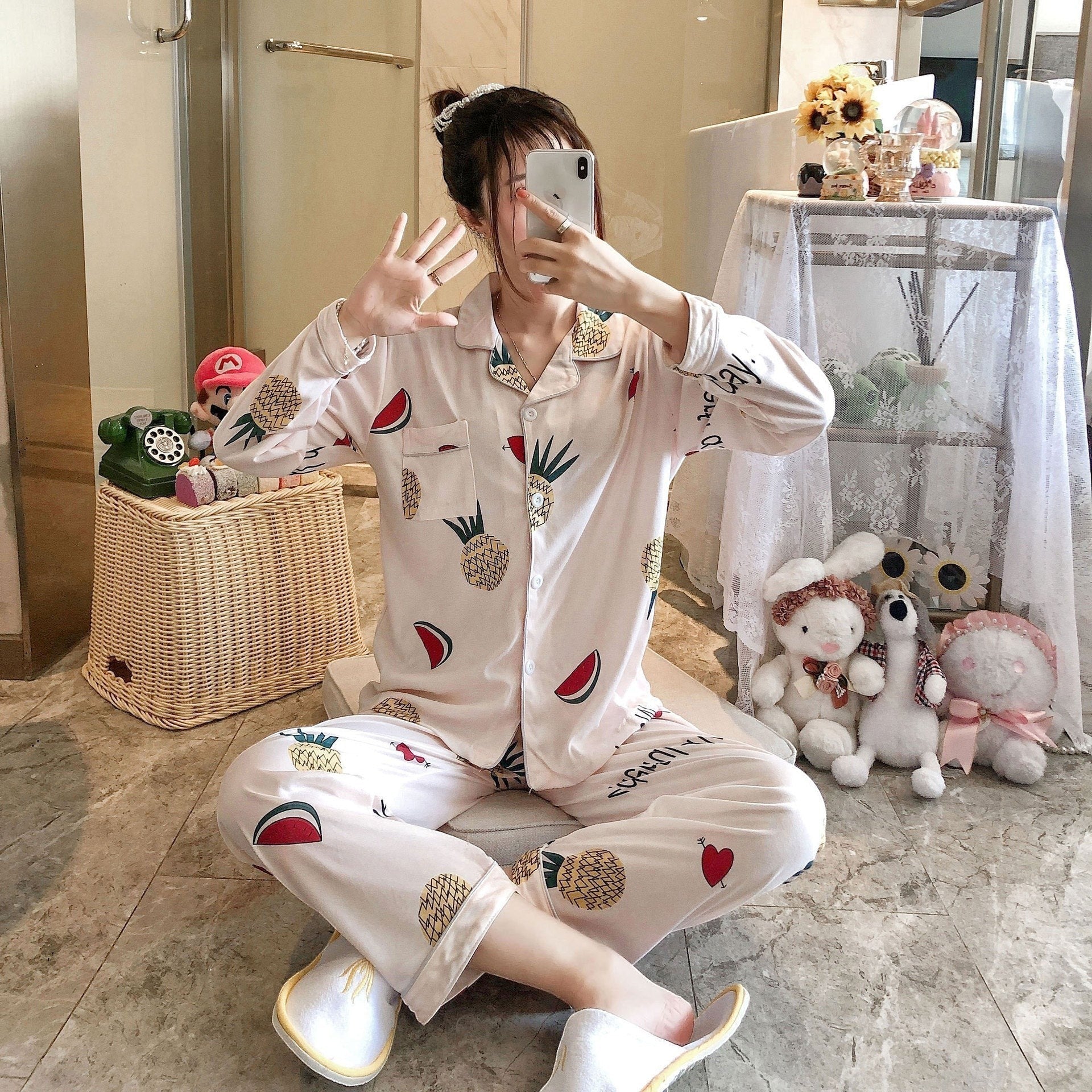 My Store Women's light pink pajama set with pineapple and watermelon print. Button-down top and pants.