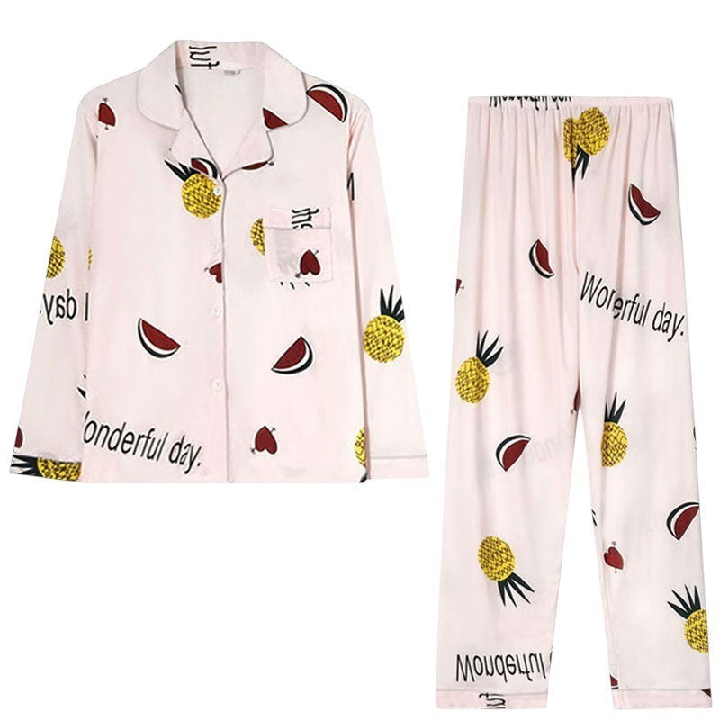 My Store Women's light pink pajama set with pineapple, watermelon, and heart print. Button-down top and elastic waist pants.